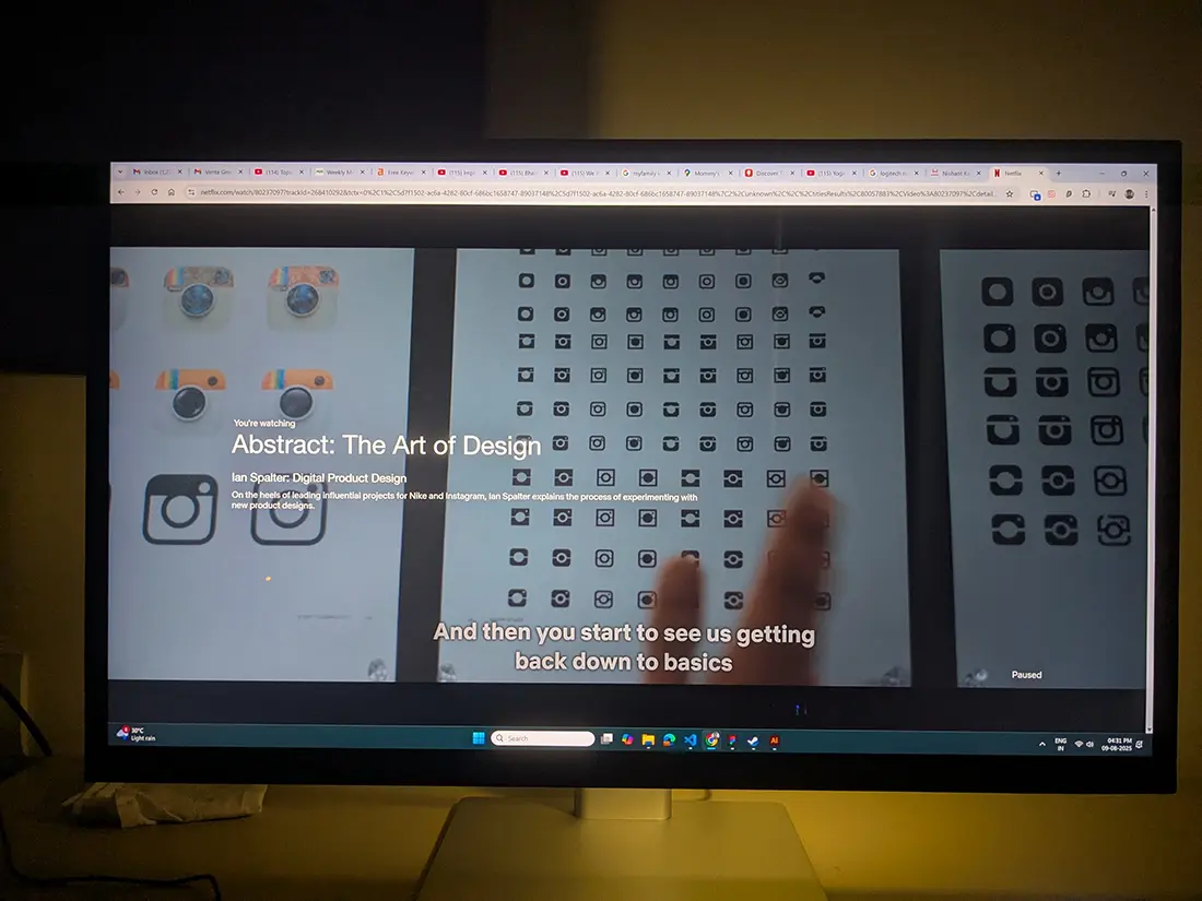 Screenshot from Netflix documentary series, Abstraction: The Art of Design. Episode 5. Scene showing a wall full of small thumbnail size logo explorations.
